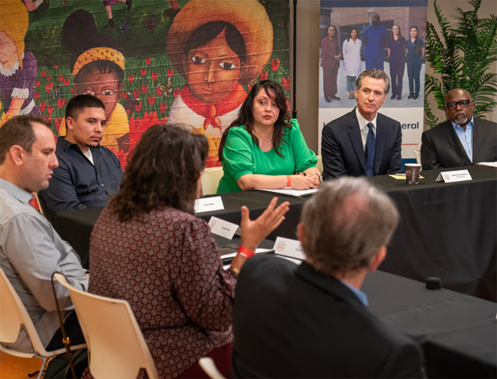 Governor Newsom at a roundtable with mental health advocates. Shortly afterward, he signed the historic reform to the Mental Health Services Act.